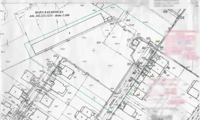 Mapa zasadnicza do warunków zabudowy z zaznaczonymi działkami, budynkami i infrastrukturą. Skala 1:500.